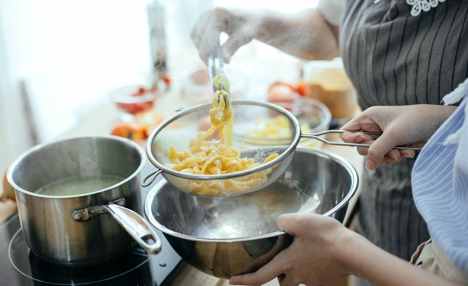 Volunteers cooking together at Hive Hope